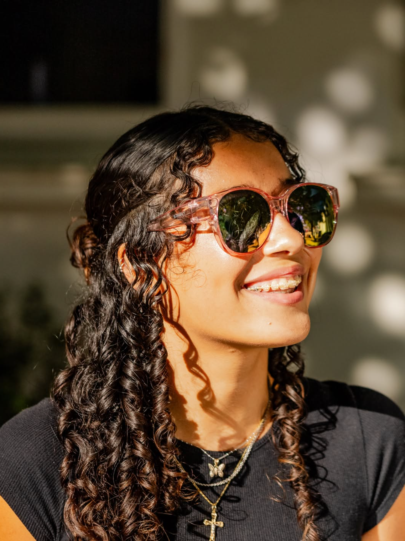 Woman wearing sunglasses with a blurred background